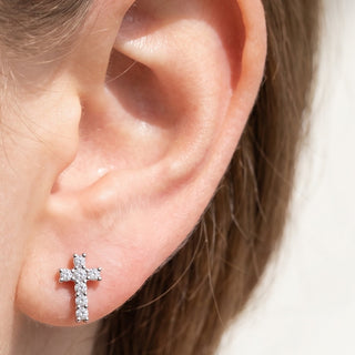 Cross Ear Piercings – selection on linen